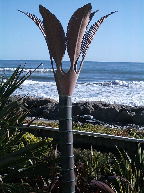Sculpture in the yard at Wave Watchers holiday cottage Punakaiki