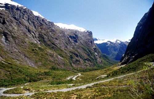 The Milford Road winds its way through prehistoric valleys towards Milford Sound