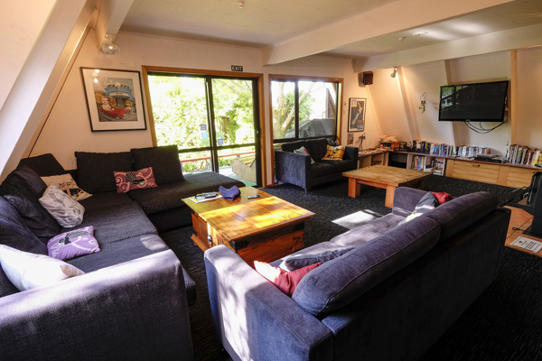 Relax in the spacious lounge at Haka Lodge Christchurch