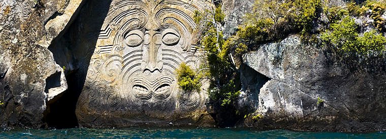 Amazing Maori rock carvings at Mine Bay - pic courtesy Viator - click for more information on how you can see these amazing carvings